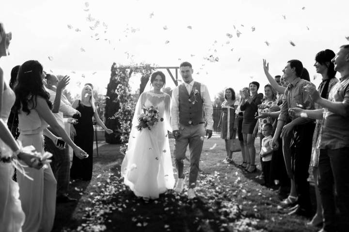 newlyweds celebrate with guests after ceremony in 2026 09 24 15 46 11 utc